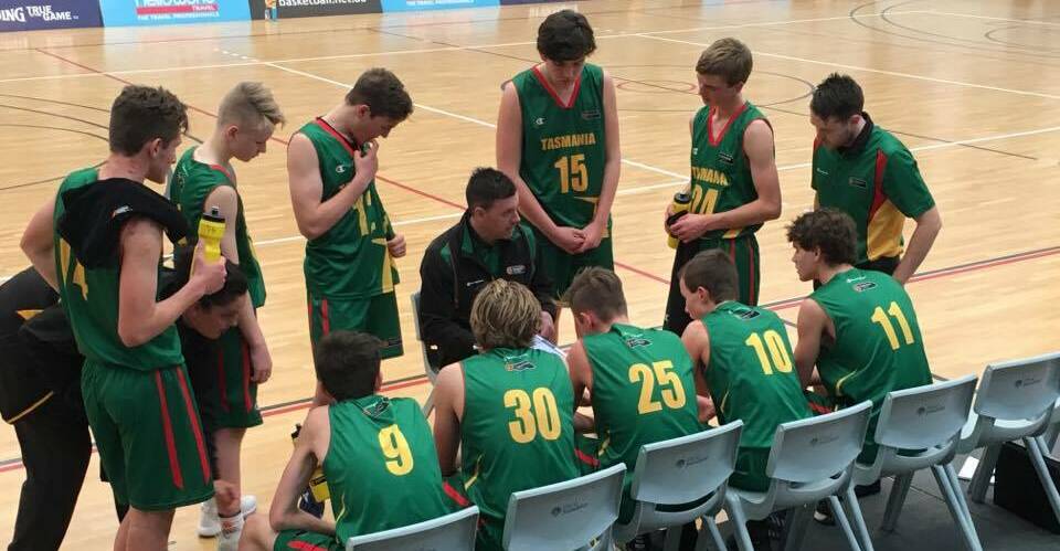 GAME PLAN: Tasmanian under-16 coach Ben Armstrong delivers instructions to his players during the Australian under-16 championships. Picture: Shannon Anis
