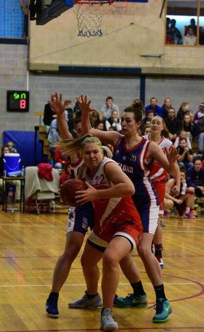 TORNS TOUGH: Launceston forward Tayla Roberts shows strength under the basket over Geelong in Saturday night's conference preliminary final. Picture: Paul Scambler