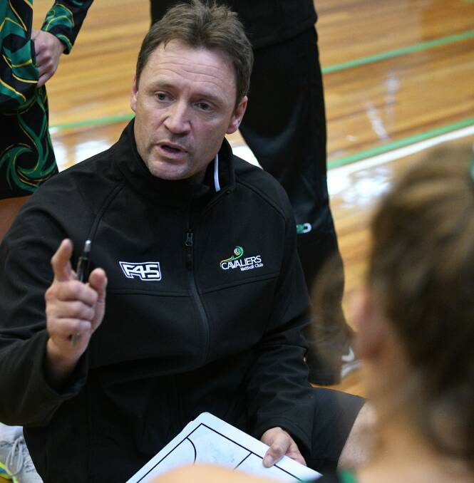 INFLUENCE: Coach Dan Roden makes his point to his Cavaliers players during a break. Picture: Paul Scambler