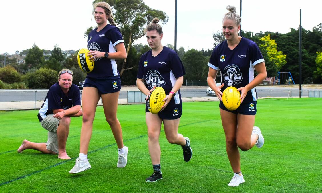 PUTTING IN THE HARD YARDS: Launceston coach Alex Gibbins watches over returning premiership Blues Abbey Green, Hayley Whyte and Georgia Hill going through their paces in the summer break at Windsor Park. Picture: Neil Richardson