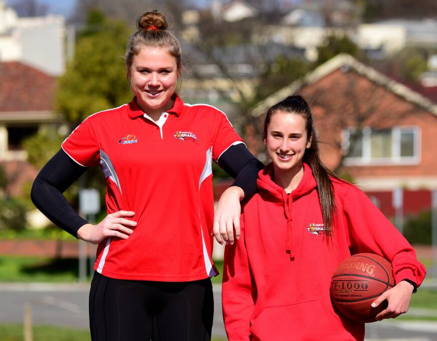 I'M BACK: Tayla Roberts, left, is set to return home to Launceston to play for her beloved Tornadoes. 