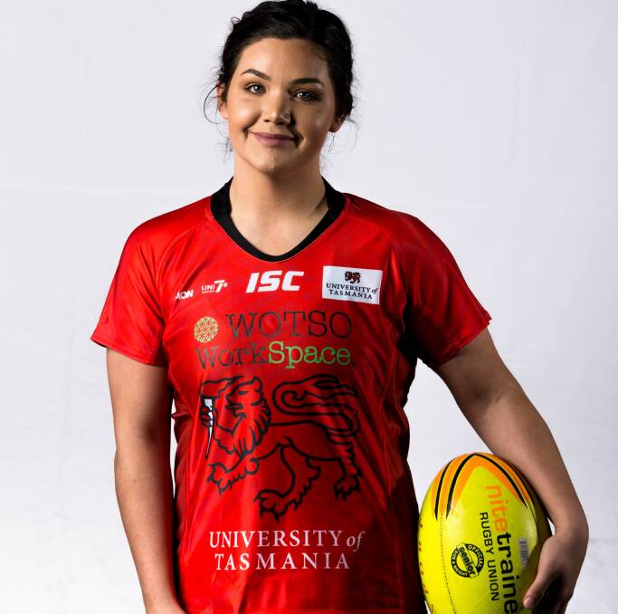 LADY IN RED: Quigley gets her first feel for the UTAS Lions kit.