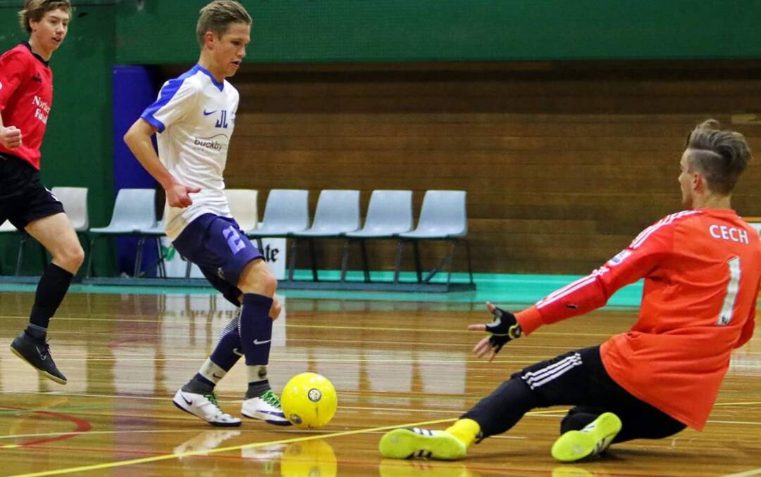 GOALBOUND: North talent Jarrod Linger looks to get the ball past the goalkeeper in the Futsal Tasmania Islander Cup final. Picture: Supplied