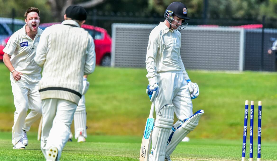 GONE: Raiders debutant Liam Ryan strolls from the wicket after Glenorchy wickettaker Nathan Matthews roars his approval.