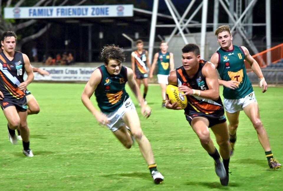 TOUGH: Tasmania chasing hard on Friday night at the under-18 national championships against Northern Territory in Darwin. Picture: AFL Tasmania