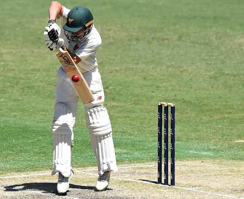 BEHIND THE BALL: Tasmanian middle-order batsman Jake Doran defends staunchly against Queensland at the Gabba in the weekend's Sheffield Shield encounter. Picture: AAP