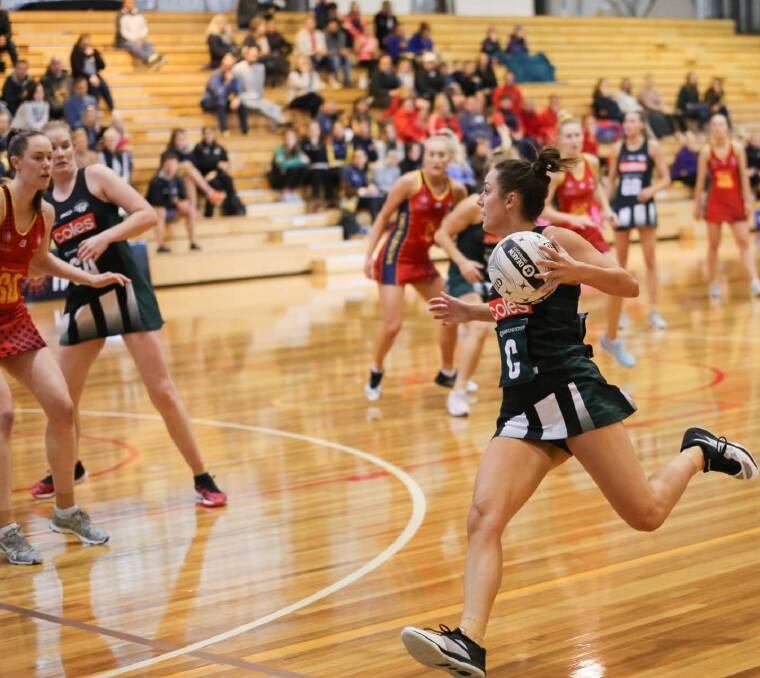 IN A HURRY: Tasmanian Magpies centre Vanessa Augustini comes charging into attack against Southern Force during Sunday's ANL battle at the Hobart Netball and Sports Centre. Pictures: Andrew Zielinski 