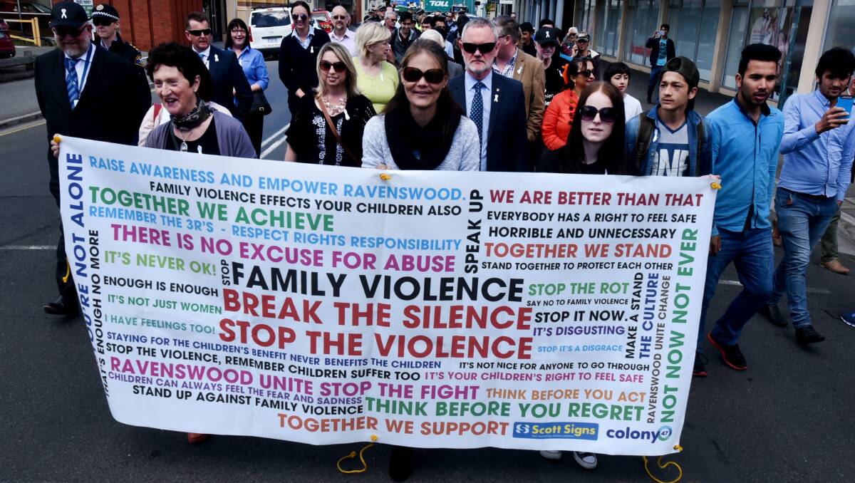 UNITED TOGETHER: Launceston men join women on Paterson St in the march on against domestic violence during White Ribbon Day on Friday. Picture: Neil Richardson