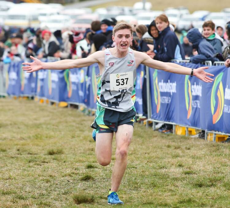 I'M COMING HOME: Launceston's Sam Clifford starts the celebration in the final metres of his national cross-country crowning glory. Pictures: Anita Welsh Photography