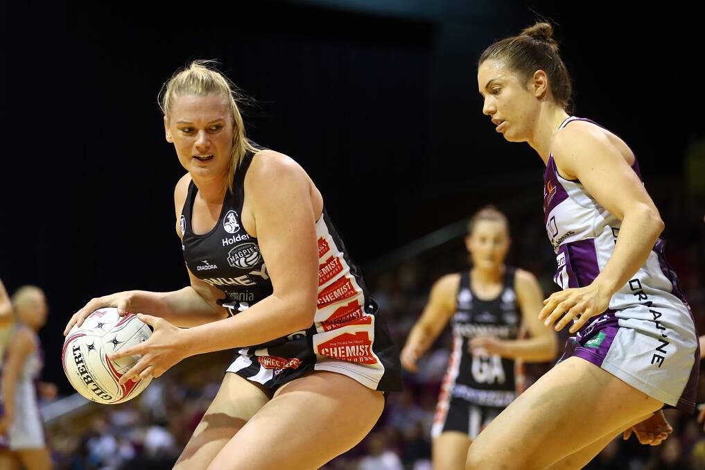 ALL MINE: Star Magpie Caitlin Thwaites takes possession in the last time Collingwood faced the Queensland Firebirds. Picture: Getty Images.