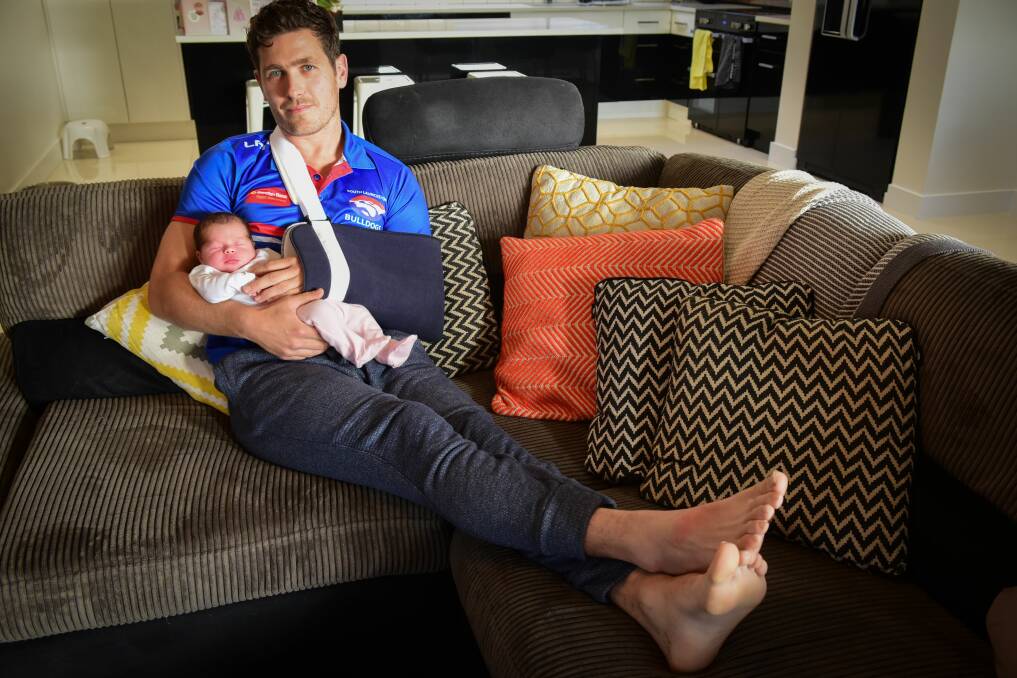 PUTTING HIS FEET UP: Fatherhood is pretty tough for the injured Adam Viney. Picture: Paul Scambler