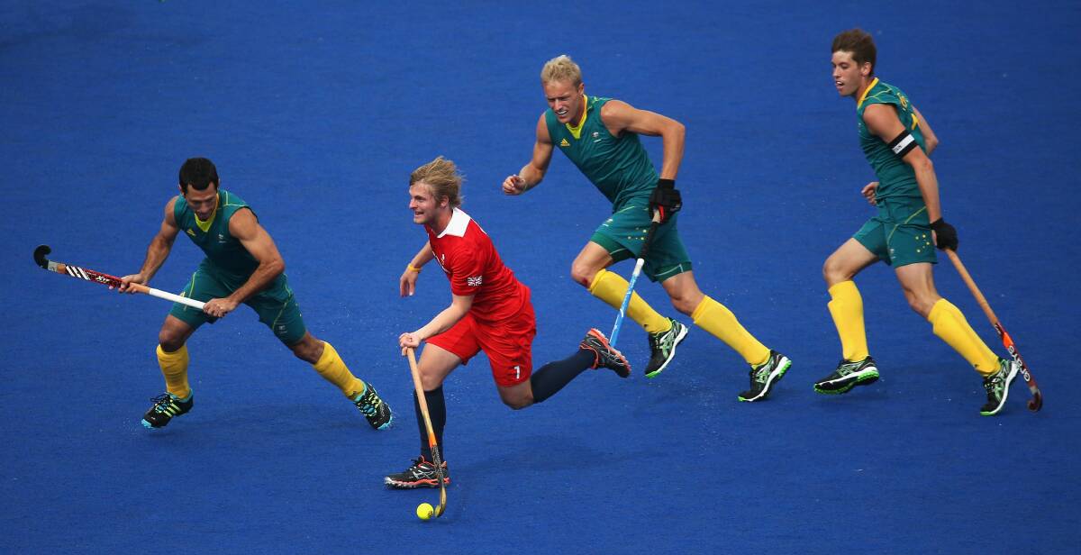 TEAMWORK: Jamie Dwyer combines with Tasmanians Tim Deavin and Eddie Ockenden during the 2012 Olympic men's bronze medal match against Team GB. Picture: Getty Images
