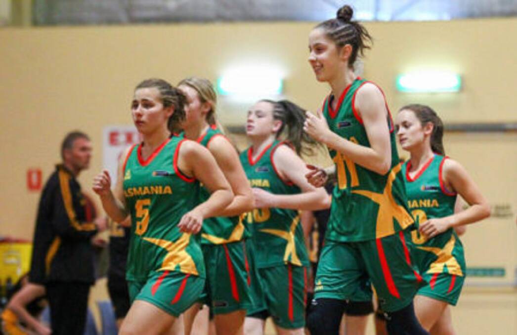 WARMED UP: Tasmania's girls goes through their paces before the Australian under-16 championships. Picture: Basketball Australia