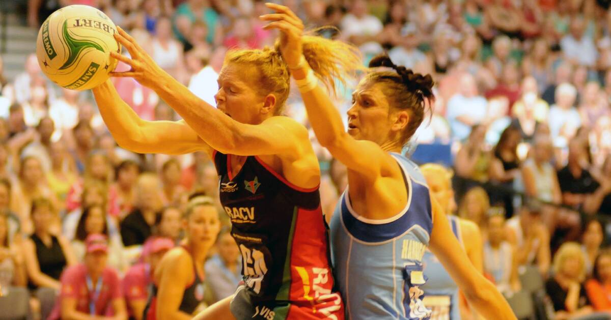 QUALITY: Melbourne Vixens' Tegan Caldwell accepts a pass ahead of Northern Mystics' Anna Harrison during the last time top-level netball was at the Silverdome in 2014.