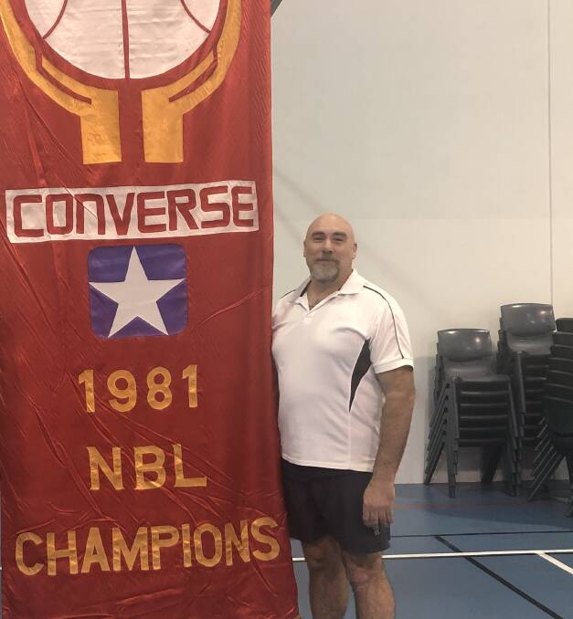 RECOVERY: Darren Cranfield with the NBL pennant in Hobart.