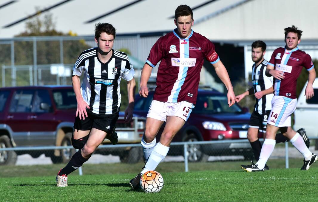 ON THE MARCH: Top Ranger Joshua Burk leads the play to the ball against Launceston City. Picture: Neil Richardson.