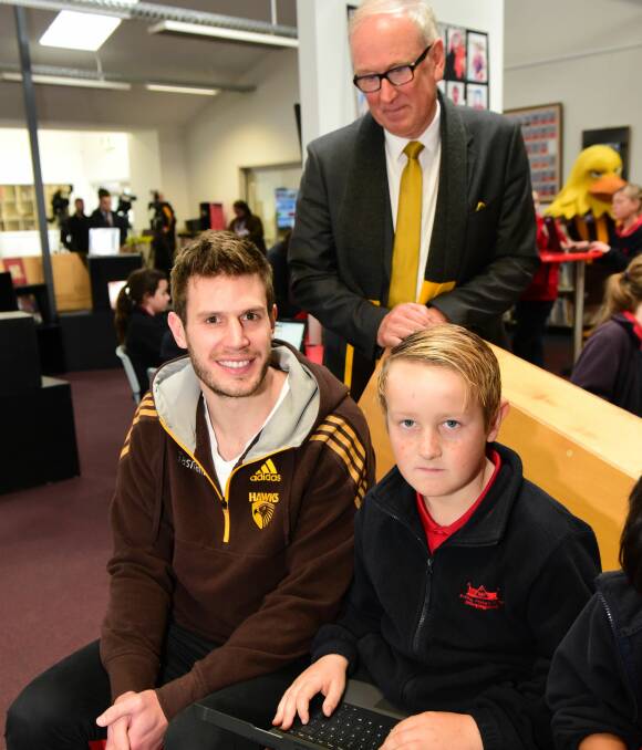 WE CARE: Hawthorn Football Club president Richard Garvey joins Hawks Tasmanian star Grant Birchall and 11-year-old student Daniel Rivette at Invermay Primary School for the Looking After Me program. Picture: Paul Scambler