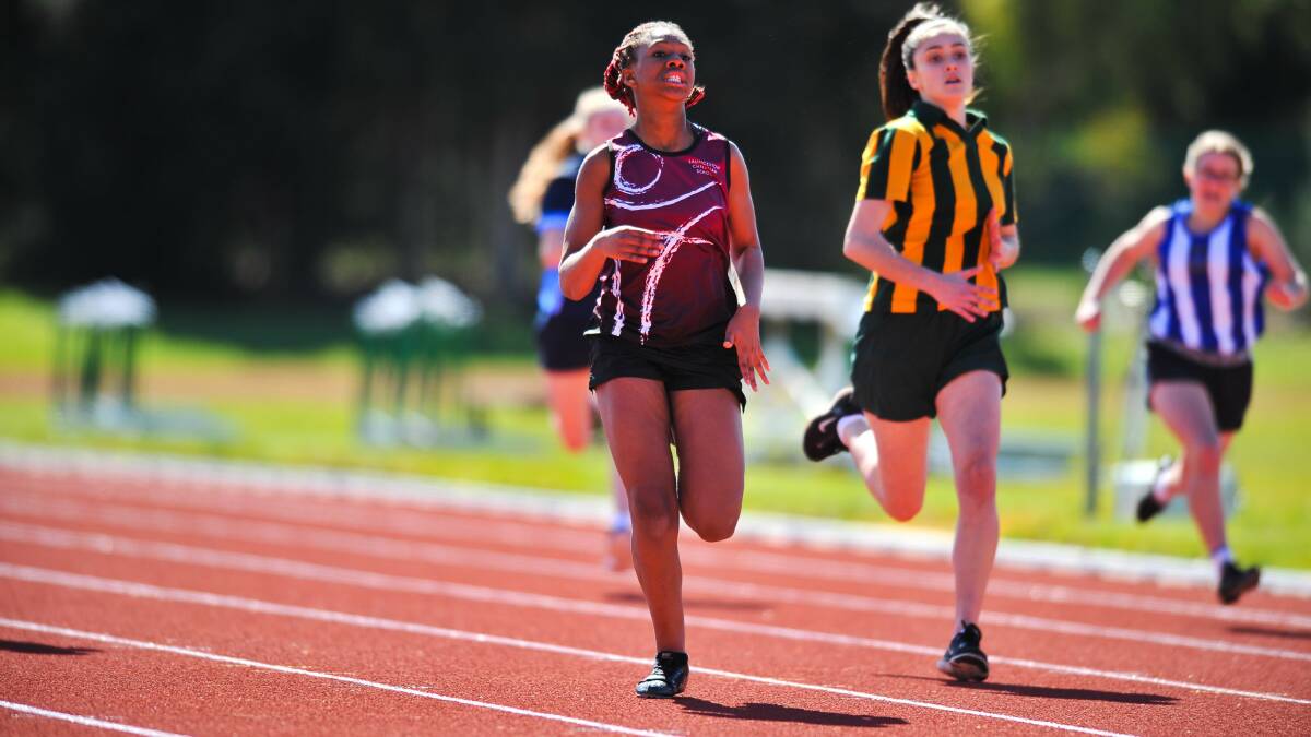 ALL HEART: Launceston Christian School's Esther Gbasie eyes off the line to finish second in the under-14 girls 200 metres.