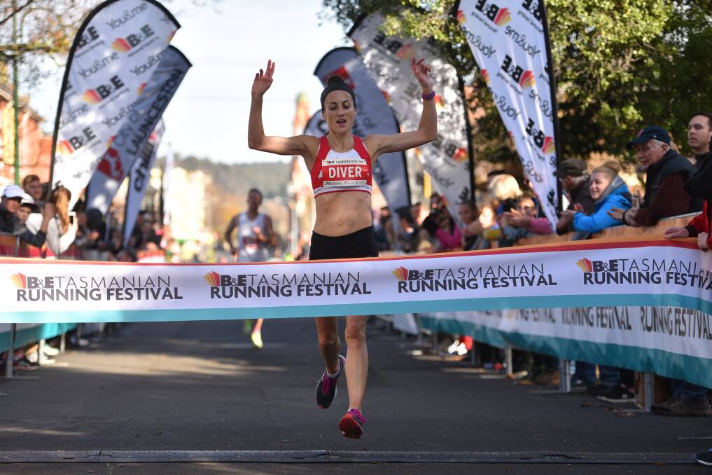 SUPERSTAR: Sinead Diver crosses the line to take the ribbon in the women's 10-kilometre after breaking away from her rivals. Pictures: Scott Gelston