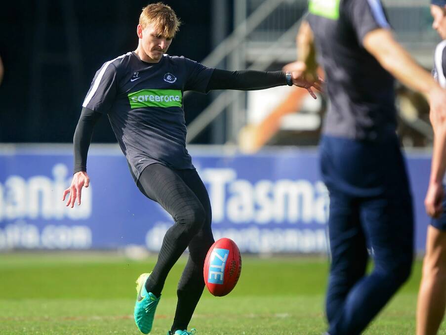 CONTACT: Carlton midfielder Dennis Armfield is a picture of concentration at training on Friday afternoon ahead of the AFL match with Hawthorn.