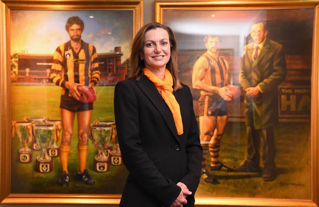 WE ARE HAWTHORN: Gaudry makes acquaintances with the portraits Michael Tuck, Leigh Matthews and John Kennedy. Picture: Getty Images.