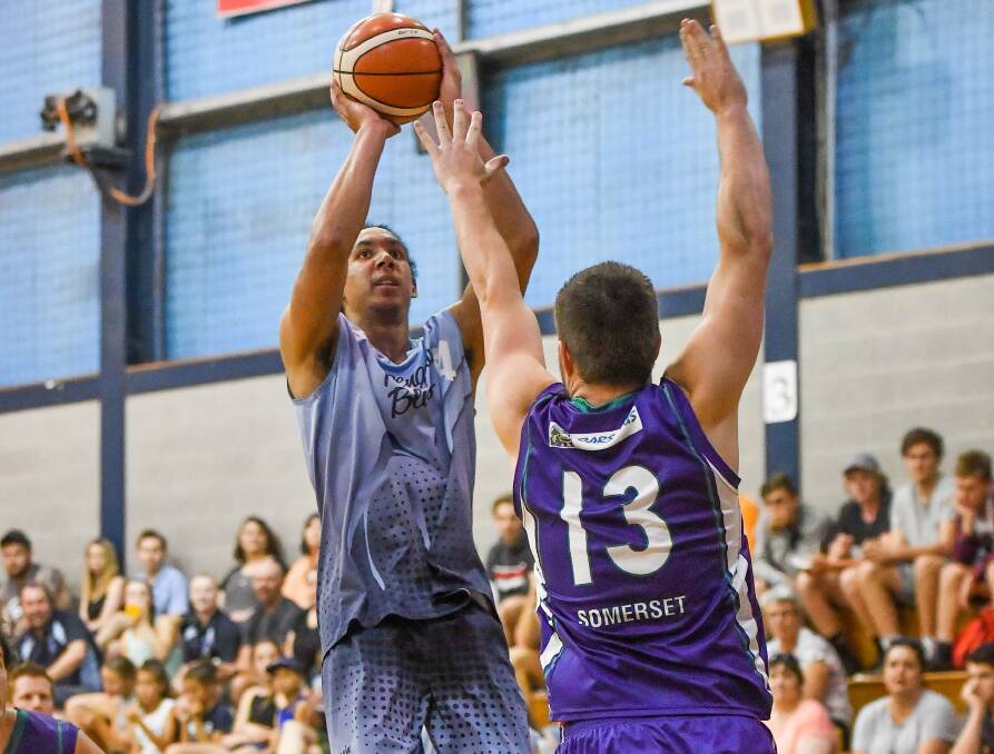 LONG RANGE: Penguin's Zachary White shoots from beyond the arc against Somerset in the men's state league basketball final at Elphin Sports Centre. Picture: Scott Gelston