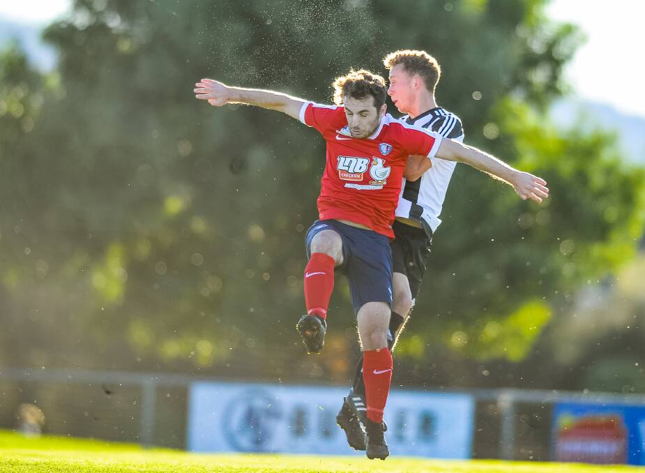 TOO GOOD: South Hobart's Caleb Ludlow can't hold back City's Dylan Williams from scoring his side's and the game's first goal of the Lakoseljac Cup clash at Bucky Land Rover Park on Saturday. Picture: Scott Gelston. 