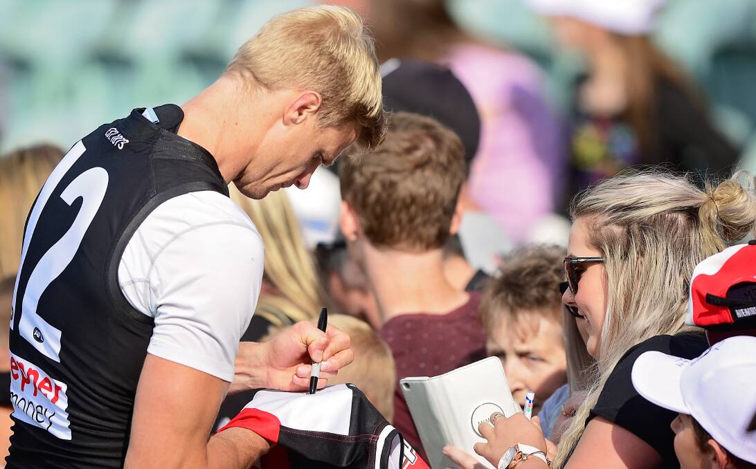 POPULAR: St Kilda captain Nick Riewoldt proves why he is as much of a champion off the field as he is on it, as he patiently embraces club fans in Launceston for his first appearance at Aurora Stadium in 10 years. Picture: Phillip Biggs