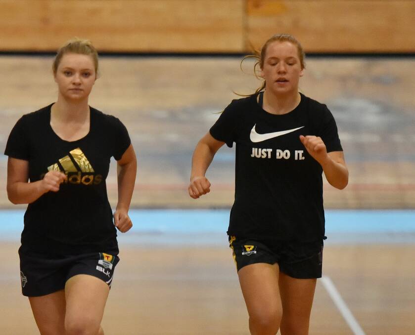 TESTING TIMES: Daria Bannister and Mia King go through their paces at last year's AFL Tasmania women's testing session at the Silverdome. Picture: Scott Gelston