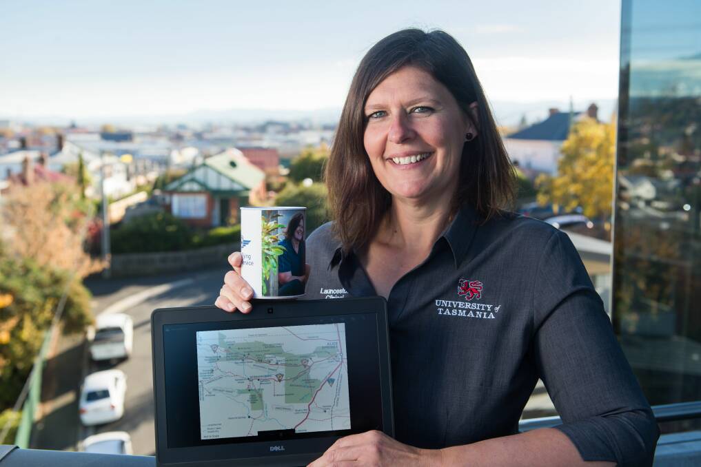GETTING EXCITED: Launceston's Zoe Page, busy preparing for her June trek, pictured here with a map outlining the trek she will be undertaking. Picture: Phillip Biggs.