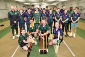 Tassie under-14 indoor cricketer Cooper Tasker, under-16 Levi Springer, under-18 Jack Coull and women's player Monique Booth in front of teammates at the NTCA Ground. Pictures by Phillip Biggs 