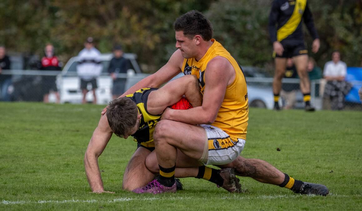 Longford's Casey Brown tackles Rocherlea's Billy Franklin in 2023. Picture by Paul Scambler 