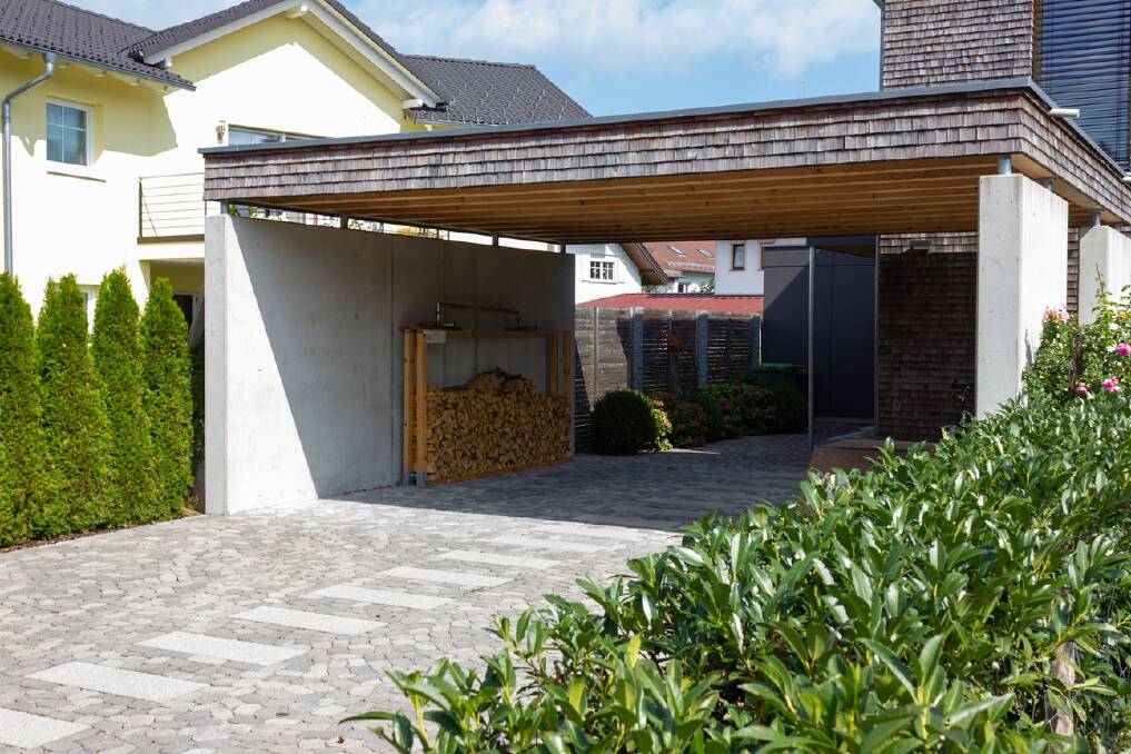 If it's not enclosed on all sides in addition to having a door for a vehicle, it's a carport (or a pergola, or a workshop, or something else), not a garage. Pictures Shutterstock
