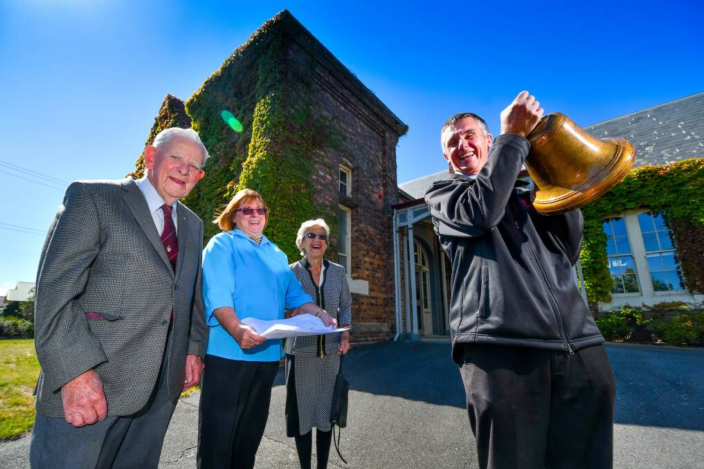Ringing: Former student Jim Anderson OAM, Parents and Friends president Carleen Edwards, and Vice Patron of the P&F Merle Sanders with Invermay Primary Principal Tony Brazendale and the school's bell. Picture: Scott Gelston