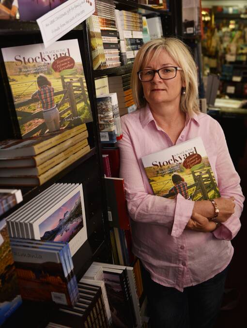 A place in the bookshop: Fiona Stocker with her book 'A Place in the Stockyard' charting the history of women in Tasmania's agricultural industries. Picture: Scott Gelston