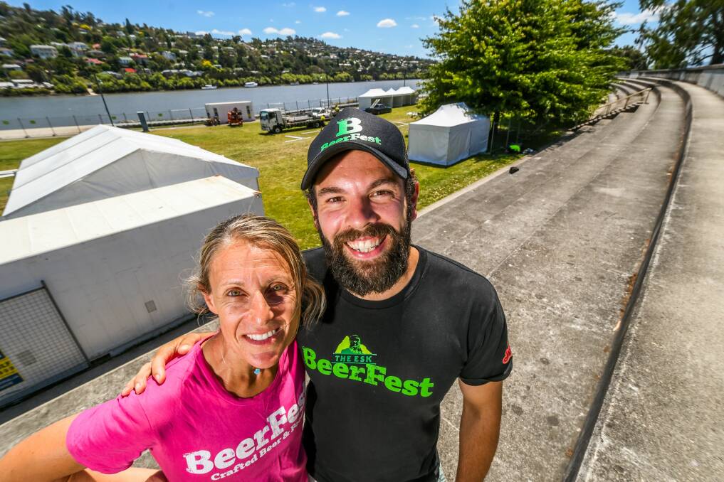 Cheers: Esk Beerfest directors Stacy File and James Harding midway through setting up for the 2018 event at Royal Park. Picture: Phillip Biggs