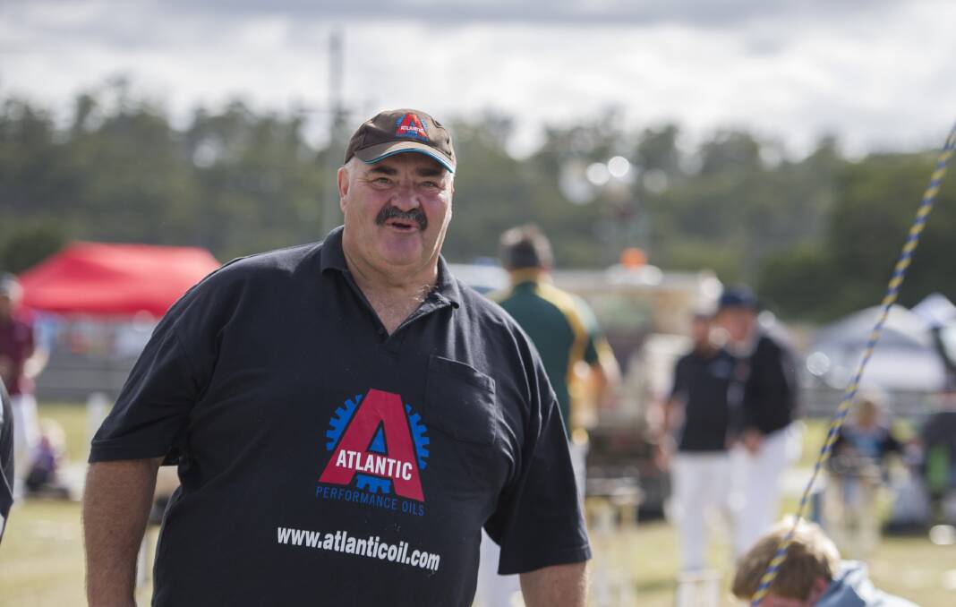 Champion: David Foster at Exeter Show, president of the Tasmanian Axemen's Association, enjoys a chat with spectators before taking part in the next competition.
