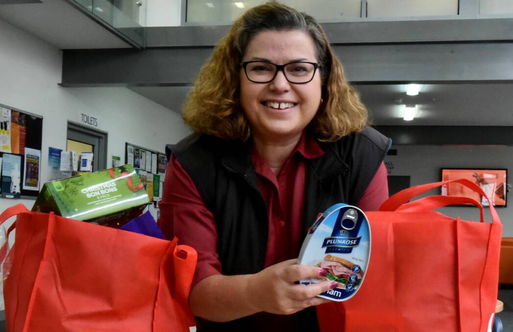 Christmas cheer: The Salvation Army's Anita Reeve with Christmas hampers ready to go out to families in need. Picture: Neil Richardson