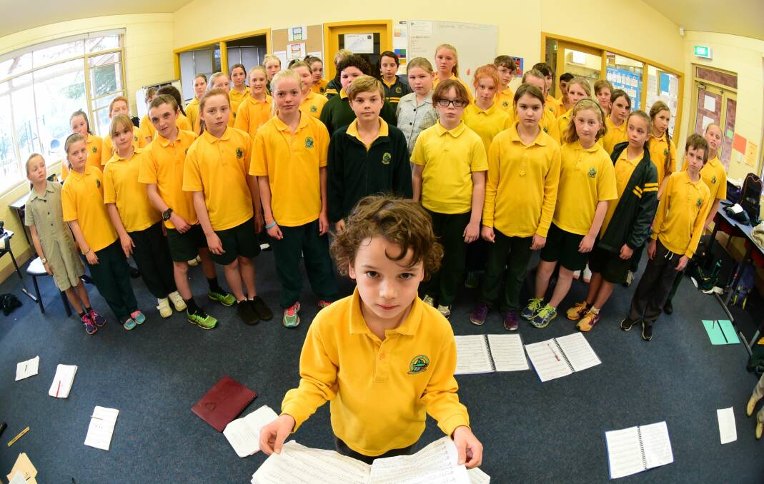 Sing: The senior choir at Exeter Primary school rehearses for the upcoming Festival of Voices, with Dylan Gelston at the front. Picture: Paul Scambler