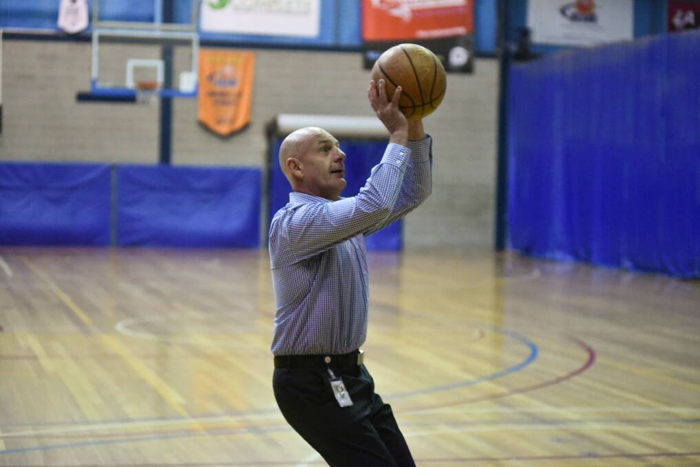 Score: Treasurer Peter Gutwein tests out the Elphin Sports Centre basketball court. Picture: Neil Richardson
