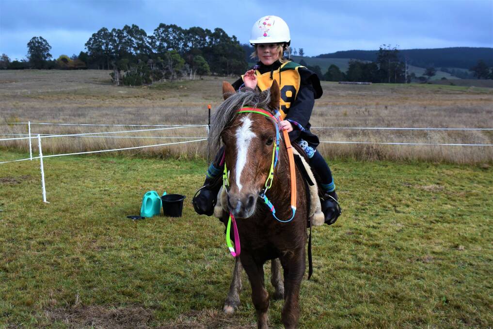 Winners: Niah Marjanen, five-years-old, celebrates completing her second 20-kilometre endurance ride on Shadow the Welsh Section B pony at the Lockhart Endurance Challenge. Picture: Lucy Stone