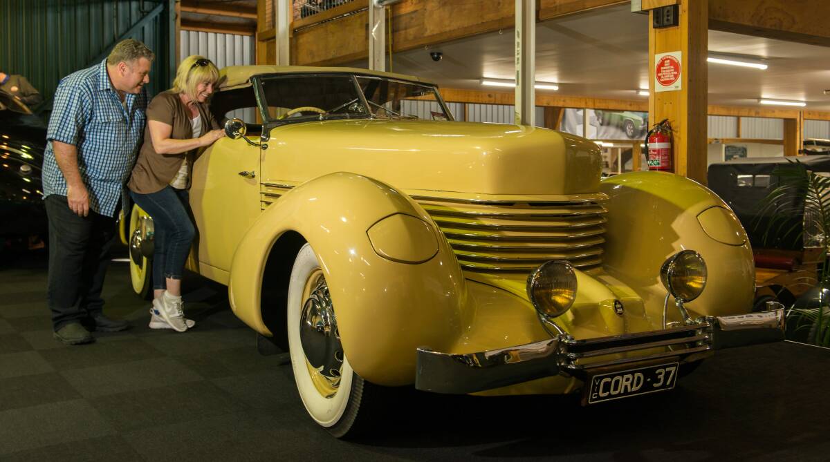 Classic: Agostino and Michelle Gattellari of Sydney, visitors to Launceston, look over a 1936 Cord at the National Automobile Museum's new American classics exhibition. Picture: Phillip Biggs