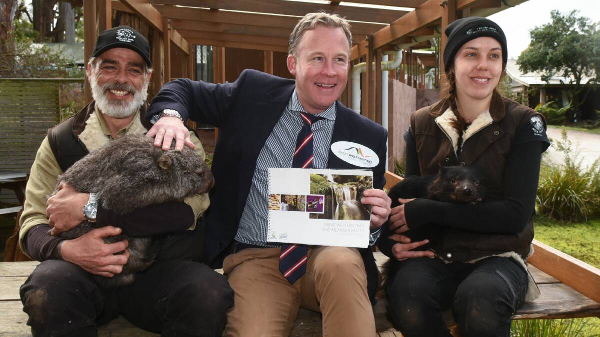 Launch: Premier Will Hodgeman with Ned Sharman and Matilda the wombat and April Stubbs with Mopoke the Devil. Picture: Neil Richardson