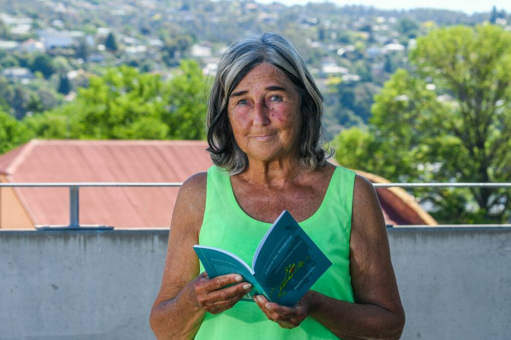 Stories: Launceston author and nurse Heather Donaldson with her book of childhood short stories There Be Dragons, published by 40 Degrees South. Picture: Phillip Biggs