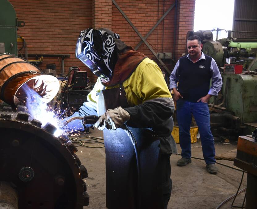 At work: John Hutton watches boilermaker and welder Ian Grant. Picture: Paul Scambler