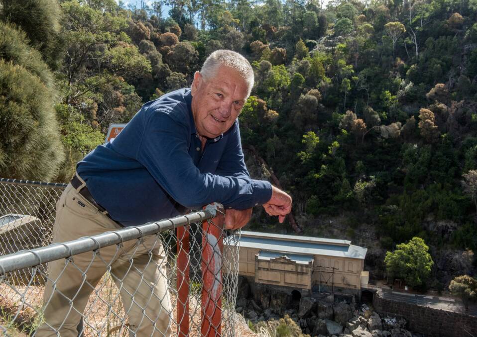 Overlook: Duck Reach Historical Group chairman Shane Dennington at the site of the proposed new museum which would extend over the cliff face and look down on the Duck Reach Power Station. Picture: Neil Richardson