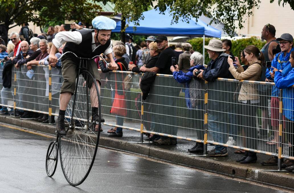 Racing: Grant Maynard from Tasmania sprints through the Penny Farthing championships at Evandale, defying the wet and slippery conditions on Saturday. PIcture: Neil Richardson