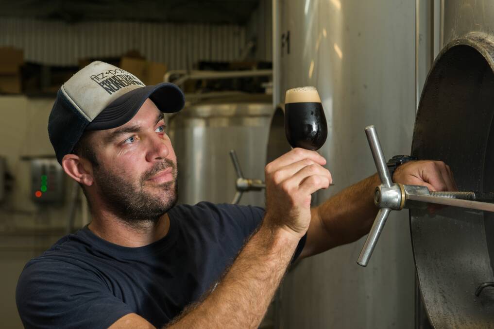 Brewers at work: Van Dieman brewery founder and head brewer Will Tatchell at work. Picture: Phillip Biggs