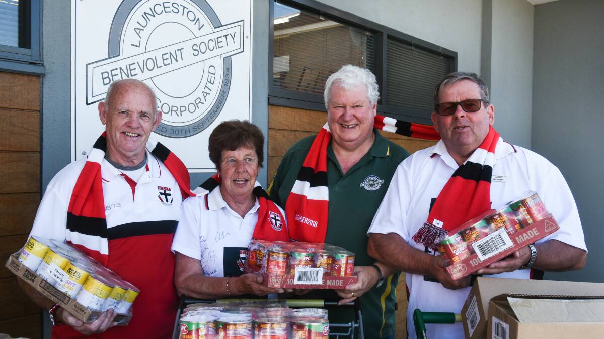 Generous: Roy Reid, Bev Catlin and Robert Anderson with John Stuart from Benevolent Society. Picture: Neil Richardson
