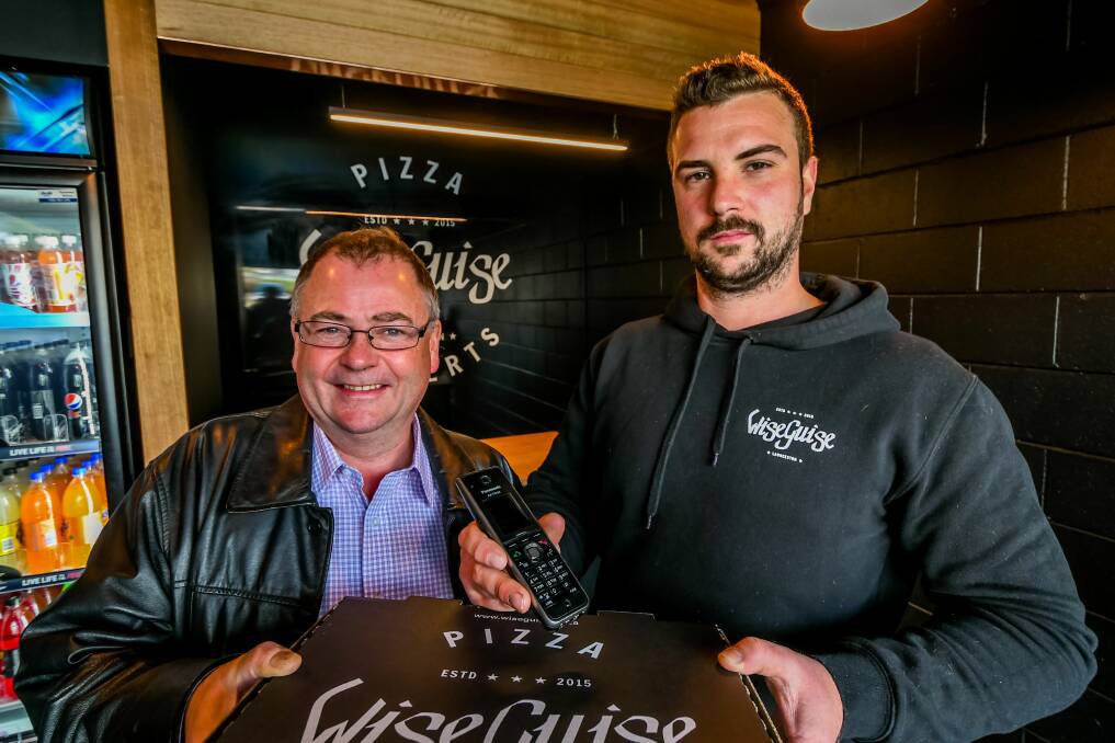 Call connected: Launtel managing director Damian Ivereigh, Wiseguise Pizza managing director Alexander Jones, at Wiseguise Pizza, Riverside. Picture: Phillip Biggs